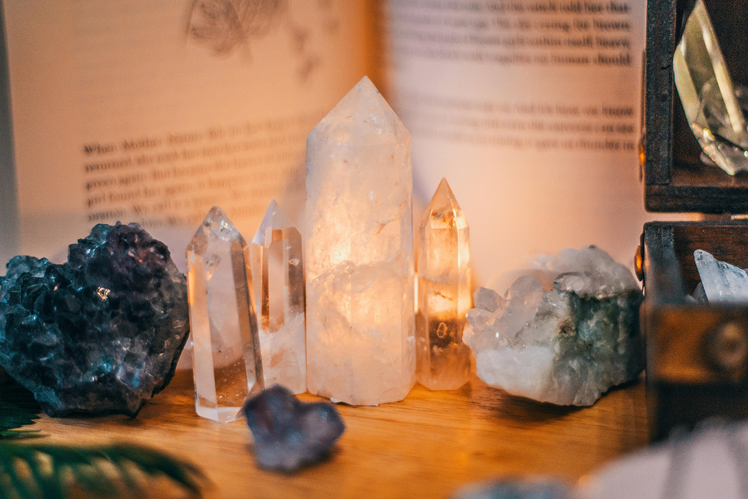 Quartz and fluorite crystals glowing in warm candlelight